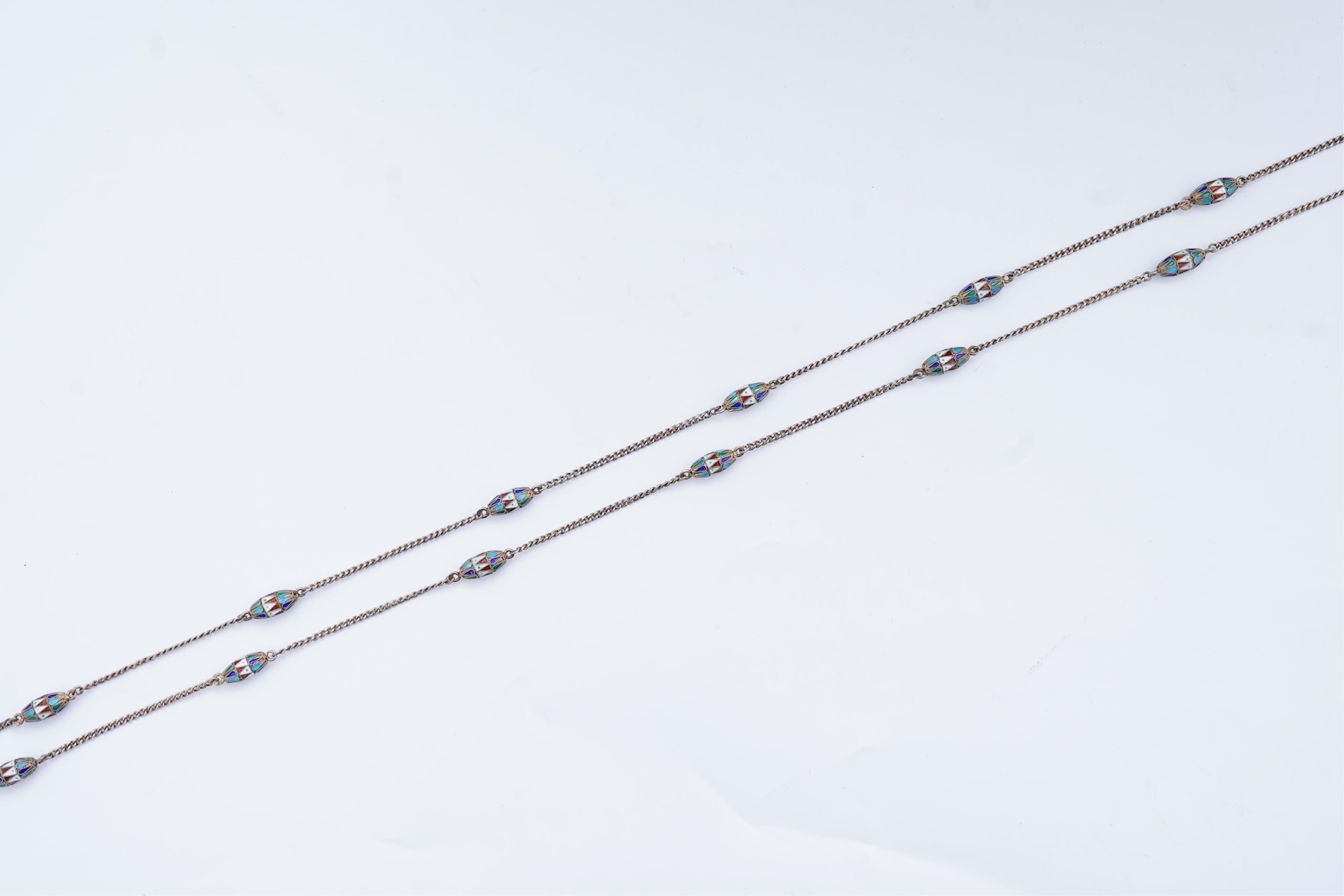 A silver and enamel long chain necklace, Russia, early 20th century